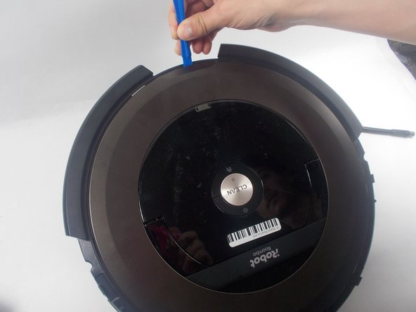 Roomba face up and remove dustbin
